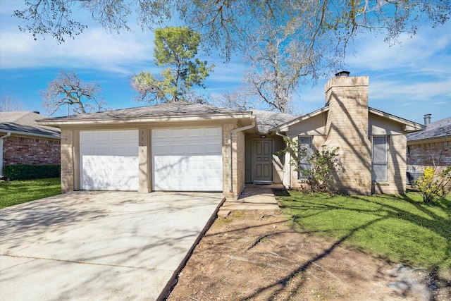 view of front of property featuring a garage, concrete driveway, a chimney, a front lawn, and brick siding