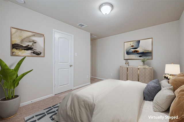 bedroom featuring light carpet, visible vents, and baseboards