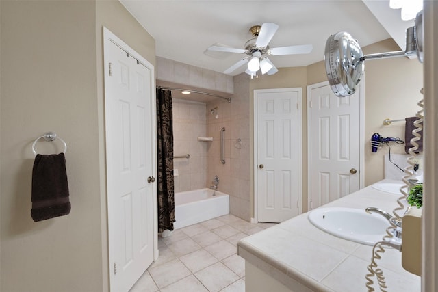 bathroom featuring shower / tub combo with curtain, double vanity, a sink, ceiling fan, and tile patterned flooring