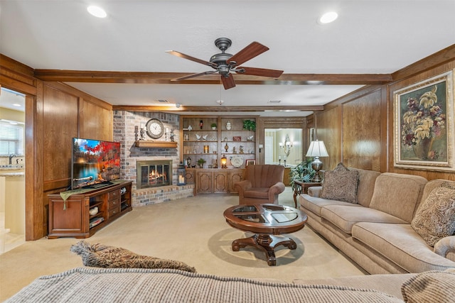 living room featuring carpet, a brick fireplace, wood walls, and beamed ceiling