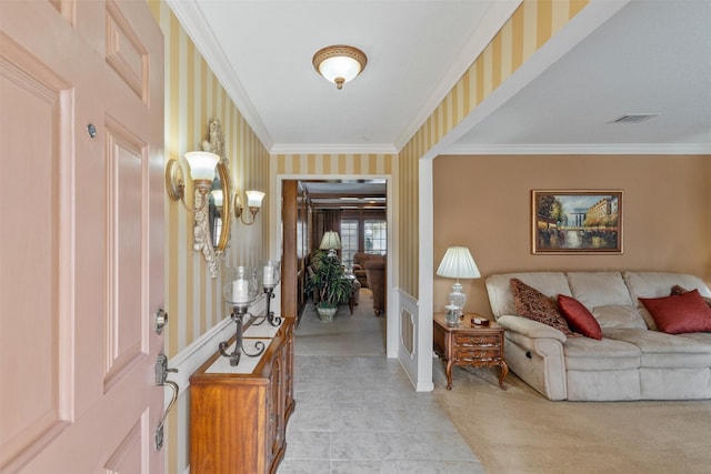 entryway featuring crown molding, visible vents, and wallpapered walls