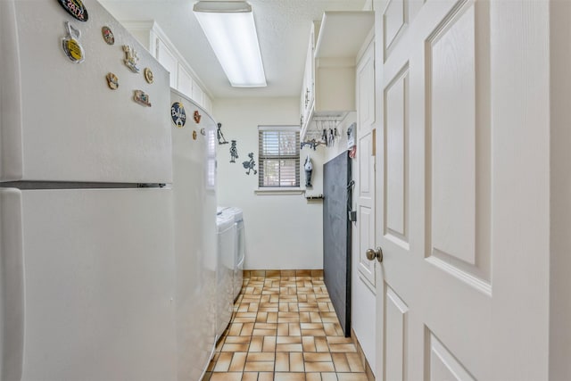 clothes washing area with laundry area and washing machine and clothes dryer