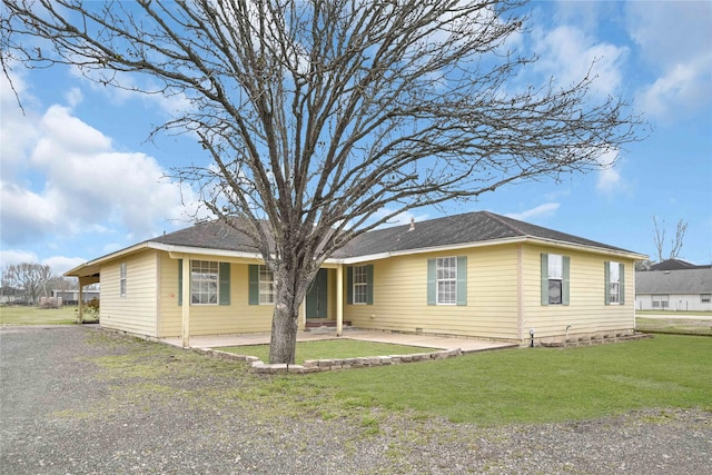 single story home with a patio area and a front yard