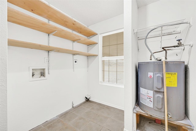 laundry room featuring laundry area, water heater, washer hookup, and electric dryer hookup