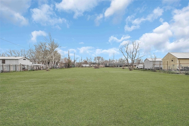 view of yard featuring a residential view and fence