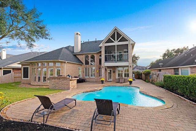 view of swimming pool with a fenced in pool, a patio area, a yard, and a fenced backyard