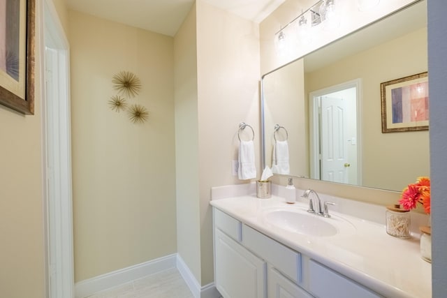 bathroom featuring baseboards and vanity