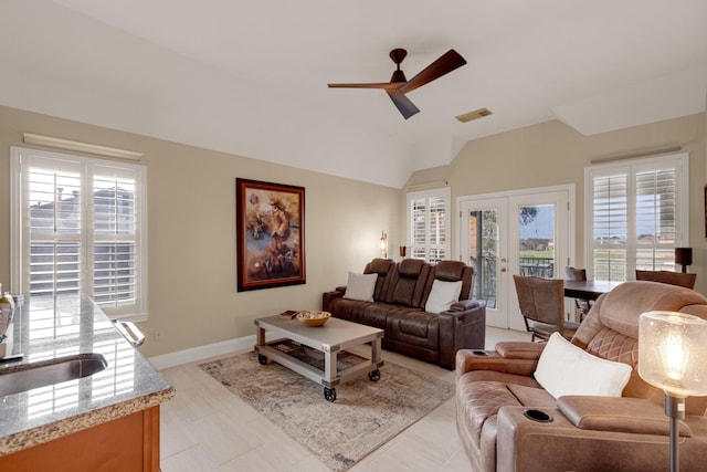 living room with visible vents, baseboards, lofted ceiling, ceiling fan, and french doors