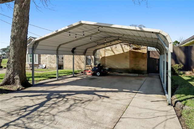 view of parking with a carport and driveway