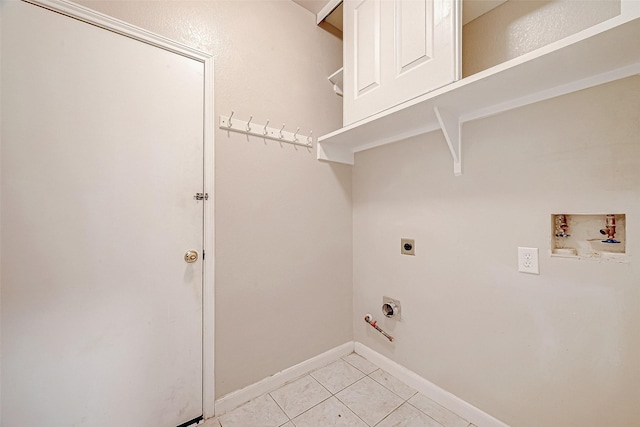 clothes washing area with washer hookup, light tile patterned floors, hookup for a gas dryer, hookup for an electric dryer, and laundry area