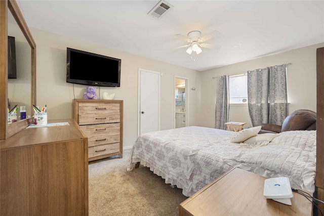 bedroom with ceiling fan, visible vents, and light colored carpet