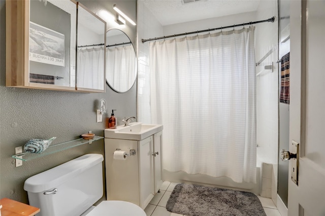 bathroom with shower / bath combo with shower curtain, vanity, toilet, and tile patterned floors