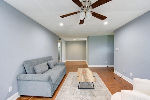 living room with ceiling fan, recessed lighting, visible vents, and baseboards