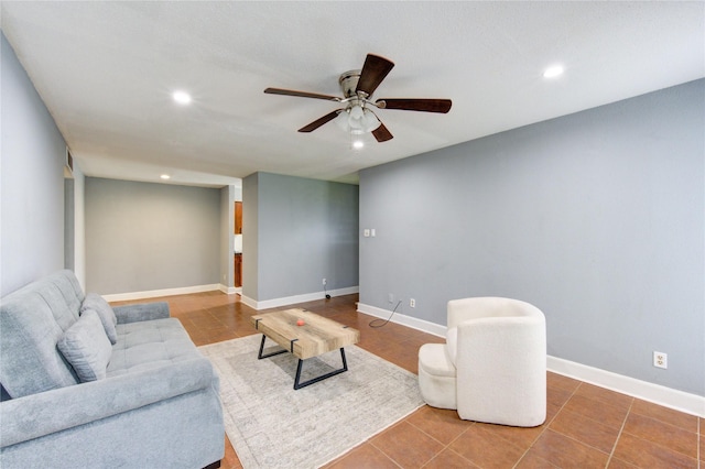 tiled living room featuring baseboards, a ceiling fan, and recessed lighting