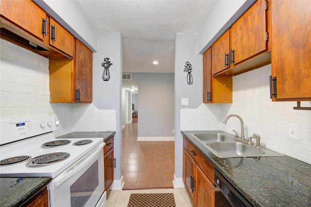 kitchen with a sink, light tile patterned floors, brown cabinets, and white range with electric cooktop