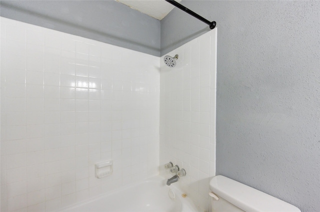 full bath featuring a textured wall, shower / bathing tub combination, and toilet