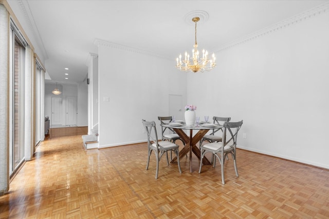 dining area featuring baseboards, a notable chandelier, and ornamental molding