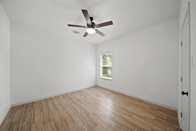 unfurnished room featuring visible vents, ceiling fan, light wood-style flooring, and baseboards