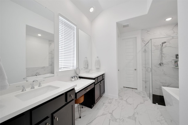 bathroom with marble finish floor, a freestanding tub, a marble finish shower, and visible vents