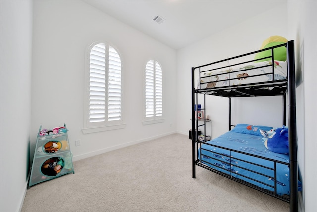 bedroom with baseboards, visible vents, and carpet flooring