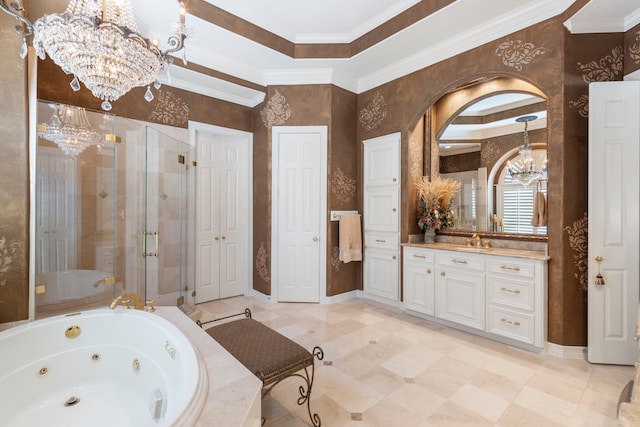 full bath featuring a chandelier, vanity, baseboards, a tub with jets, and a stall shower