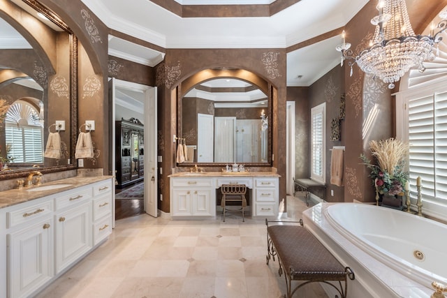 full bathroom with a tub with jets, a tray ceiling, ornamental molding, and vanity