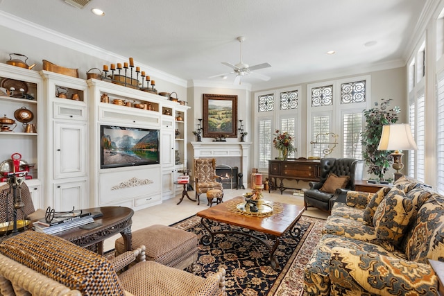 living room with a warm lit fireplace, ceiling fan, ornamental molding, and recessed lighting