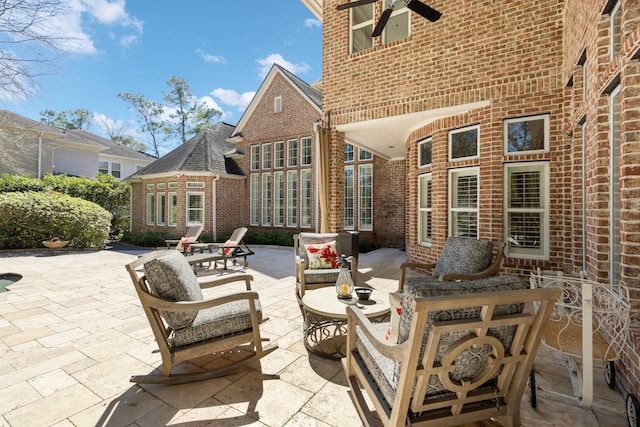 view of patio featuring ceiling fan and an outdoor living space