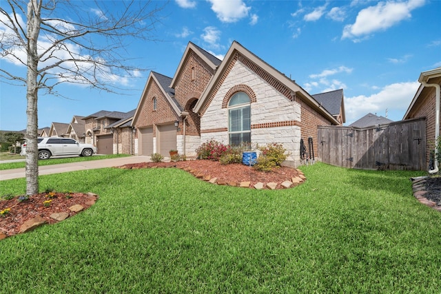 view of front facade featuring driveway, a garage, a front lawn, and brick siding