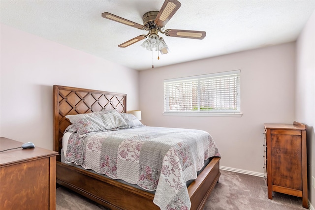 5826 Russell Ln, Baytown, TX 77521 - bedroom featuring ceiling fan, a textured ceiling, baseboards, and carpet flooring