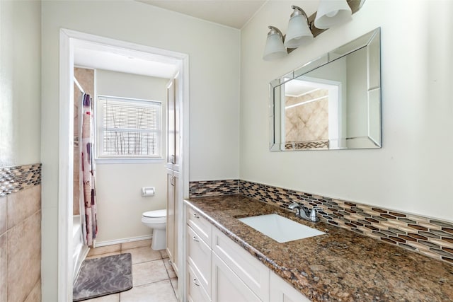 5826 Russell Ln, Baytown, TX 77521 - bathroom featuring shower / bath combo, decorative backsplash, toilet, tile patterned flooring, and vanity