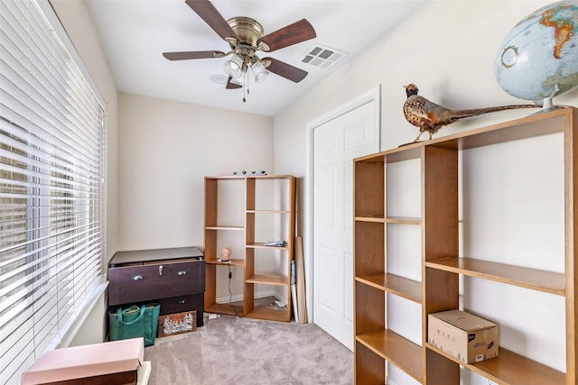5826 Russell Ln, Baytown, TX 77521 - miscellaneous room featuring visible vents, a ceiling fan, and light colored carpet