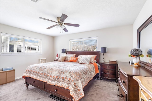 5826 Russell Ln, Baytown, TX 77521 - bedroom featuring light carpet and ceiling fan