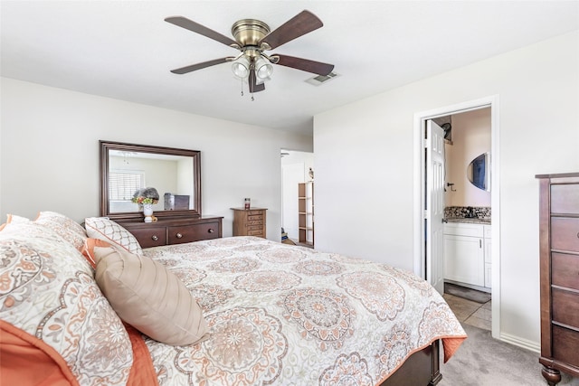 5826 Russell Ln, Baytown, TX 77521 - bedroom featuring a ceiling fan, connected bathroom, visible vents, and light colored carpet
