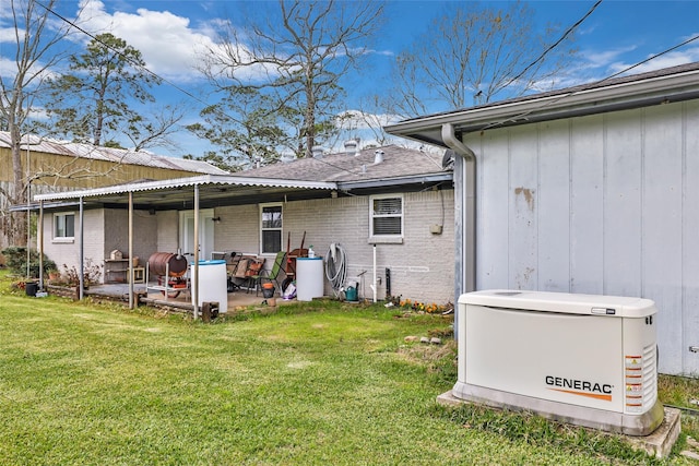 5826 Russell Ln, Baytown, TX 77521 - rear view of property featuring brick siding, a yard, and a patio