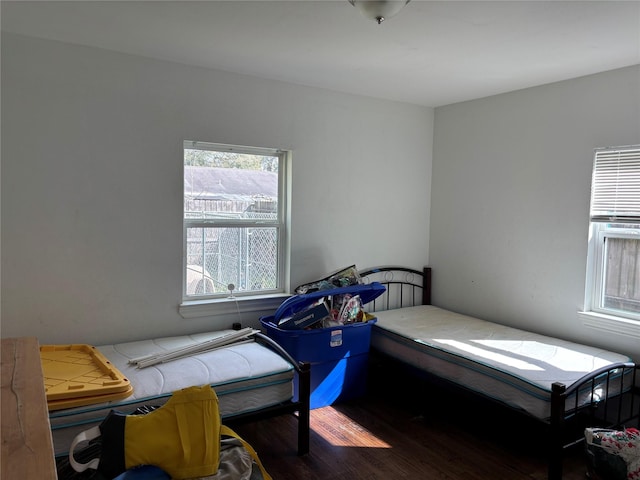 bedroom featuring wood finished floors