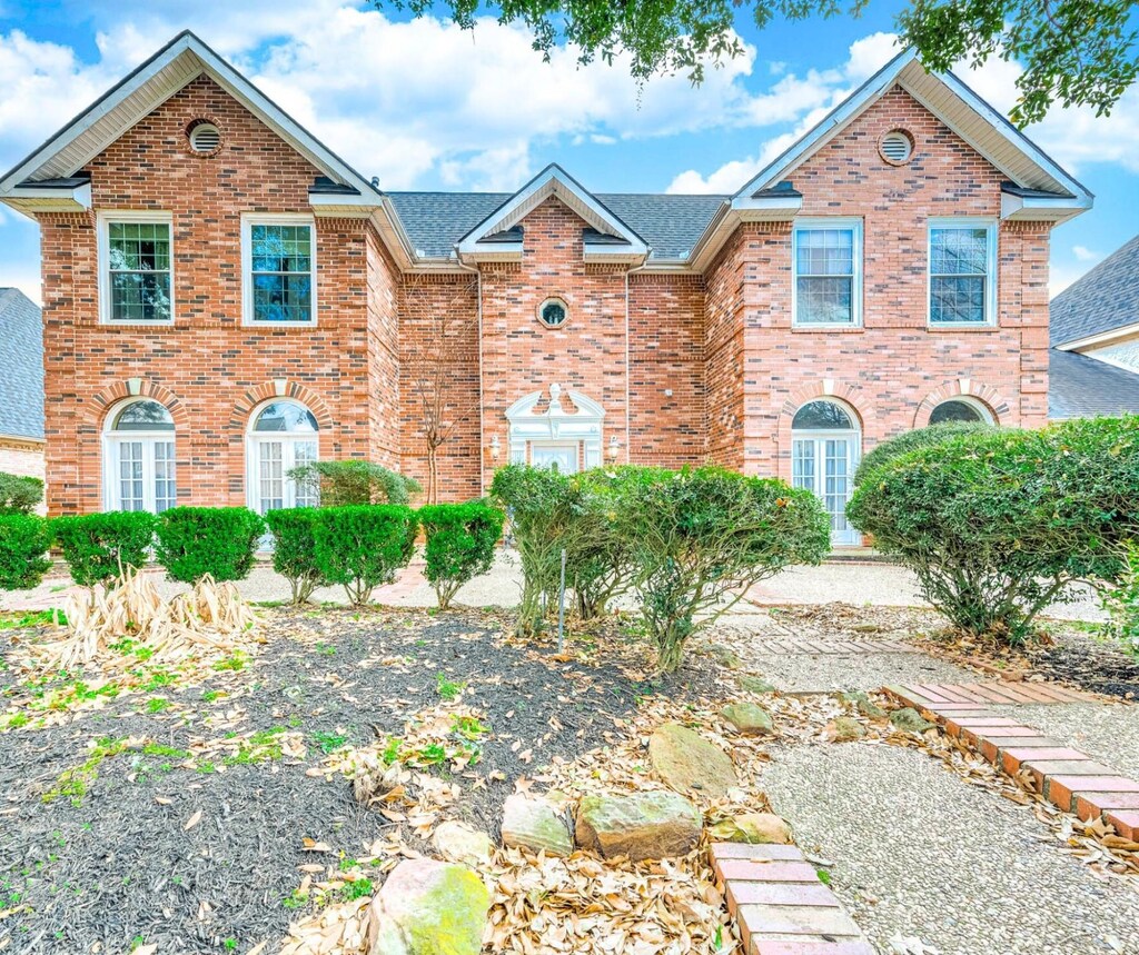 20623 Cranfield Dr, Katy, TX 77450 - traditional-style home featuring roof with shingles and brick siding