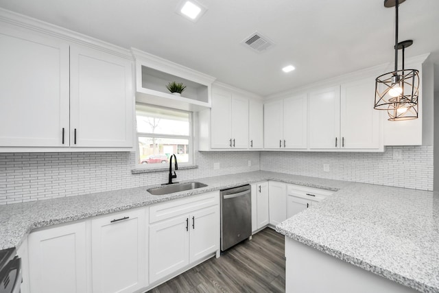 kitchen with white cabinetry, a sink, and dishwasher