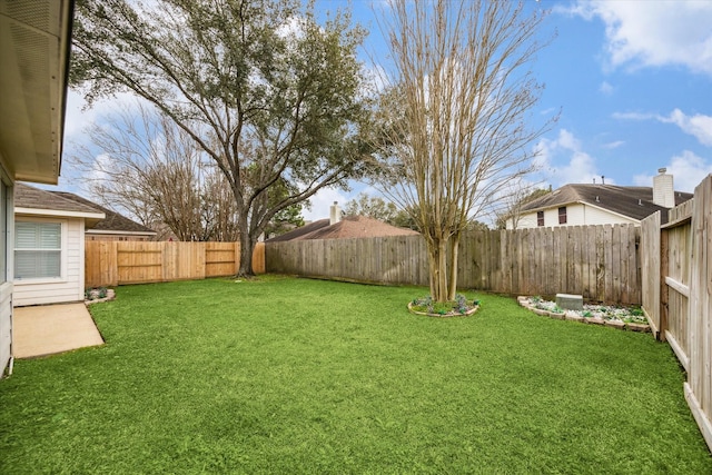 view of yard featuring a fenced backyard