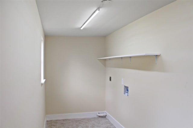 clothes washing area featuring laundry area, hookup for a washing machine, and baseboards