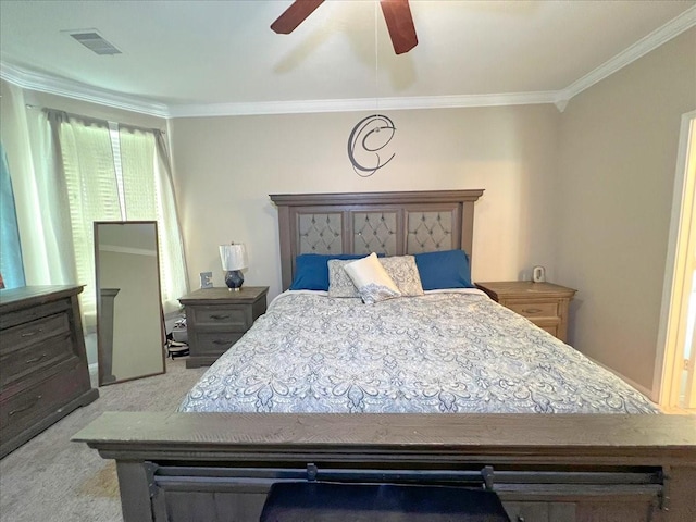 bedroom with ornamental molding, light colored carpet, visible vents, and a ceiling fan