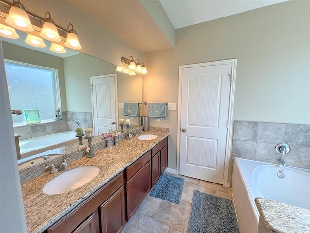 bathroom with double vanity, a sink, and a bath