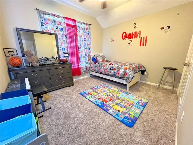 carpeted bedroom with lofted ceiling and baseboards