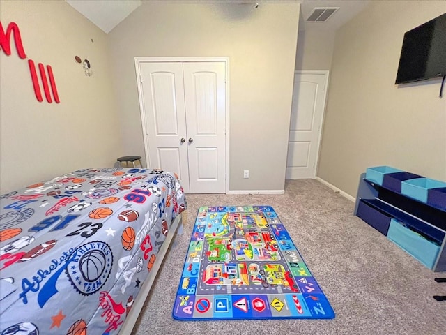 carpeted bedroom featuring lofted ceiling, baseboards, visible vents, and a closet