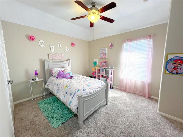 bedroom with baseboards, a ceiling fan, and light colored carpet