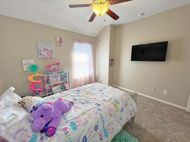 carpeted bedroom featuring lofted ceiling, baseboards, and a ceiling fan