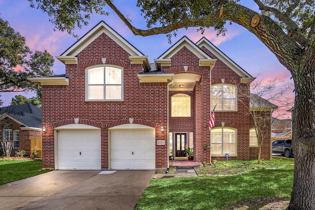 view of front of property with driveway, brick siding, a front lawn, and an attached garage