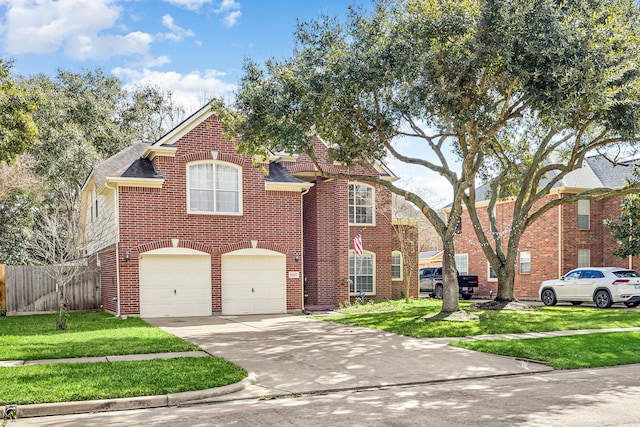 view of front facade with concrete driveway, brick siding, fence, and a front lawn