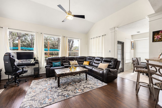 living room with vaulted ceiling, ceiling fan, and dark wood finished floors