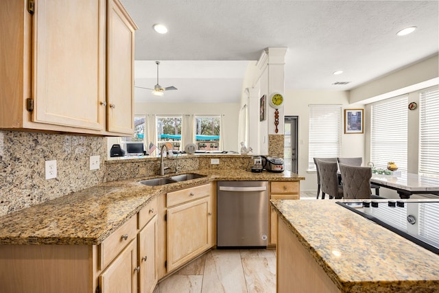 kitchen featuring a sink, light brown cabinets, and dishwasher